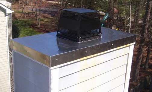 Vinyl Sided Chimney with new stainless steel Chase Cover After Repair