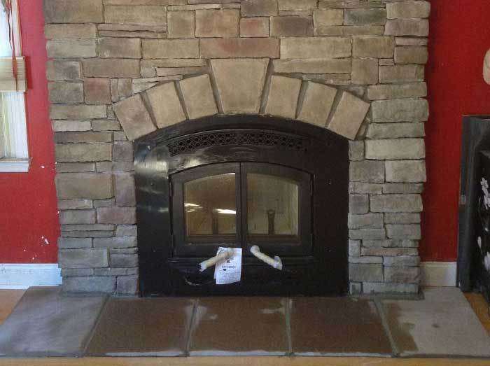 Fireplace Retro Fit After with New Arched Insert and stone surround