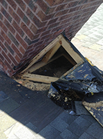Mr Smokestack Original Photo of Damages Chimney Flashing - Broadway and Raleigh, NC Red brick chimney with exposed damaged to flashing