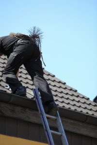 chimney sweep climbing ladder