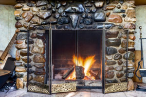 sooty stone fireplace in a home