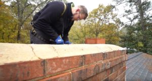 Time for a New Chimney Crown - Raleigh NC - Mr. Smokestack chimney tech repairing crown