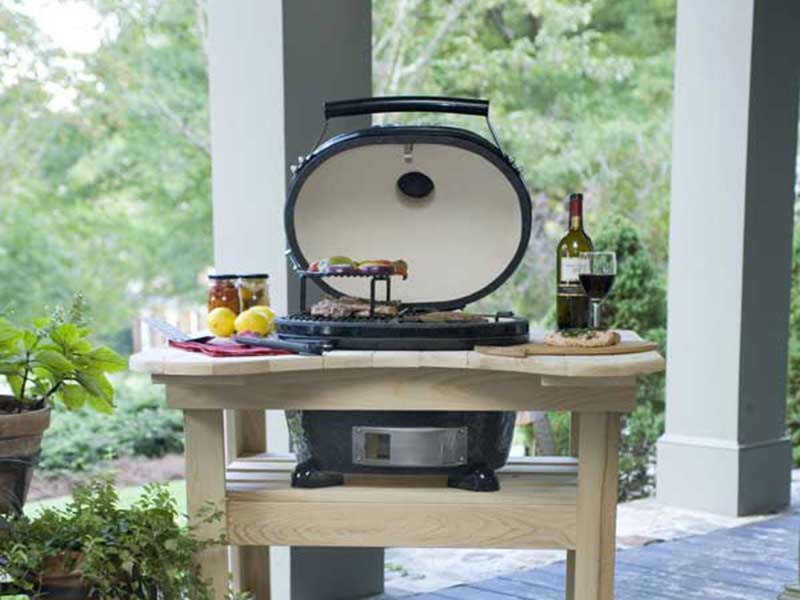 Stock Image of Primo BBQ Grill primo bbg grill with food and wine around the grill