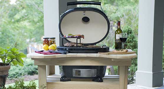 Stock Image of Primo BBQ Grill - Mr. Smokestack - Broadway and Raleigh, NC primo bbg grill with food and wine around the grill