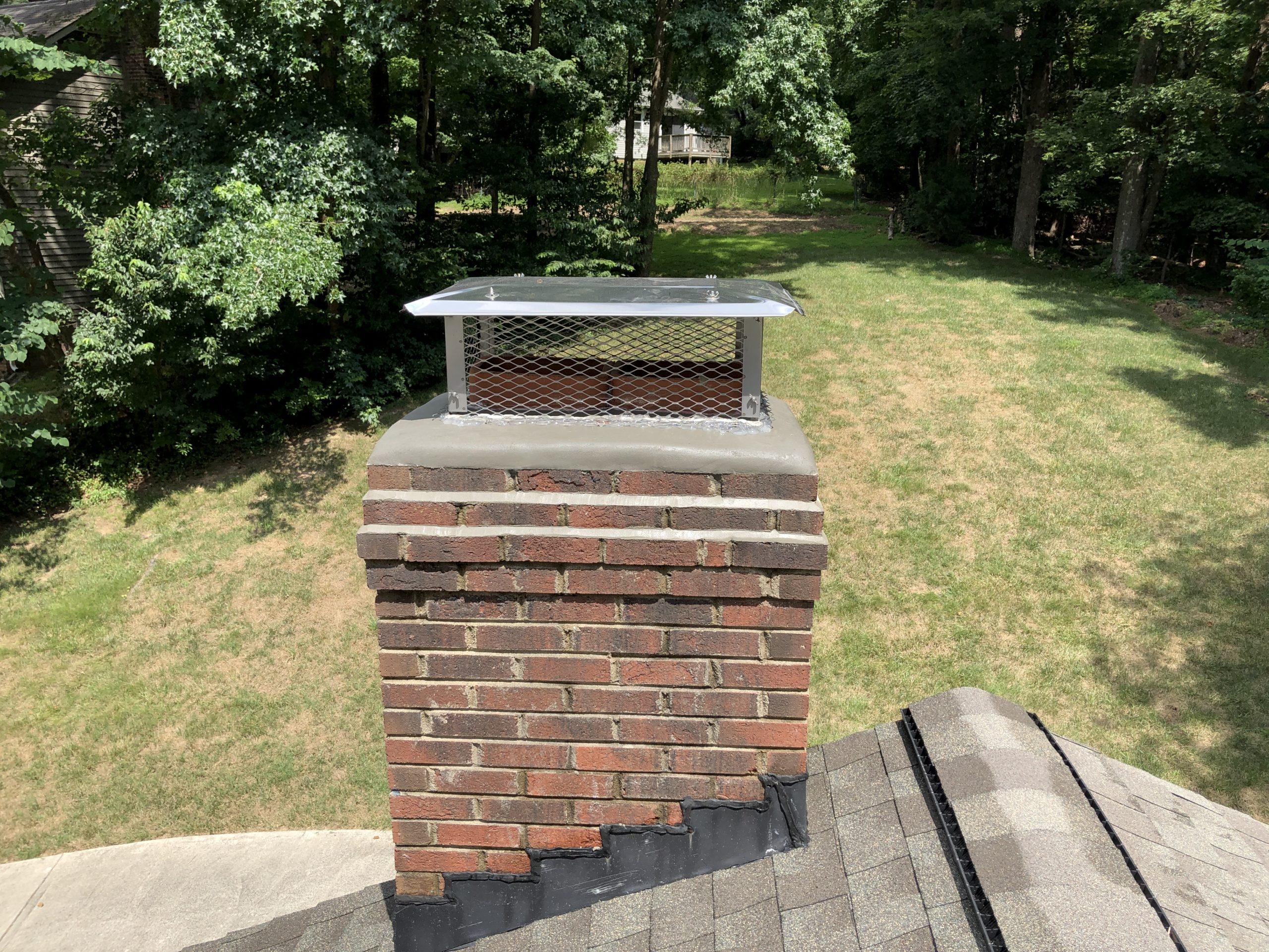 Chimney with refreshed and restored chimney crown after crown saver repair