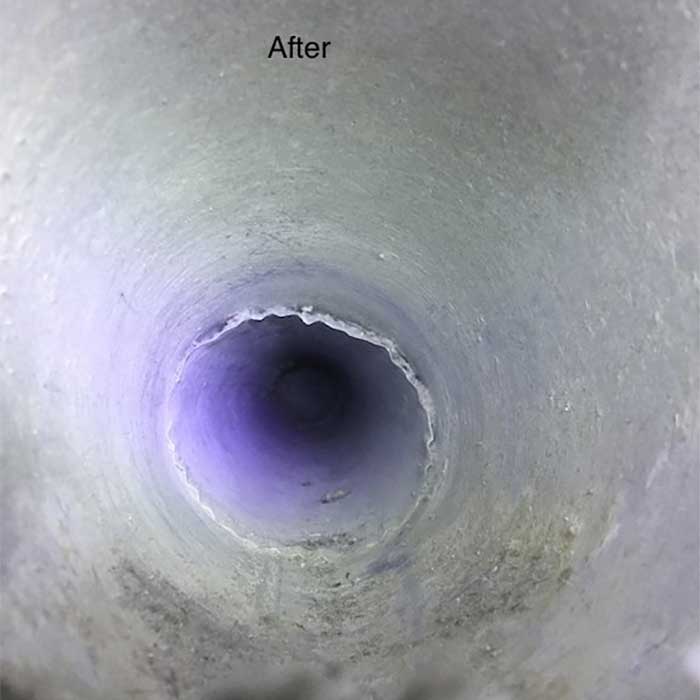 close up view of cleaned dryer vent free of build up and debris