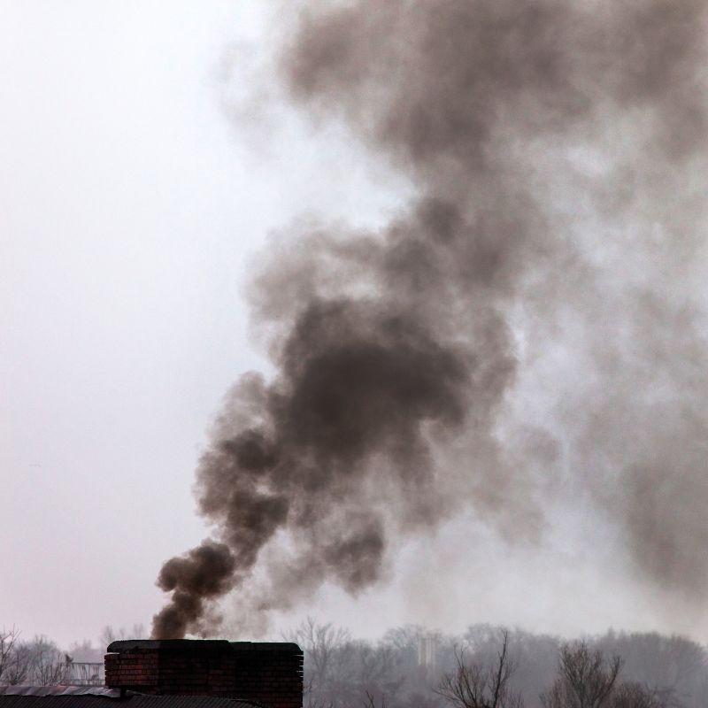 photo of chimney pouring black smoke out