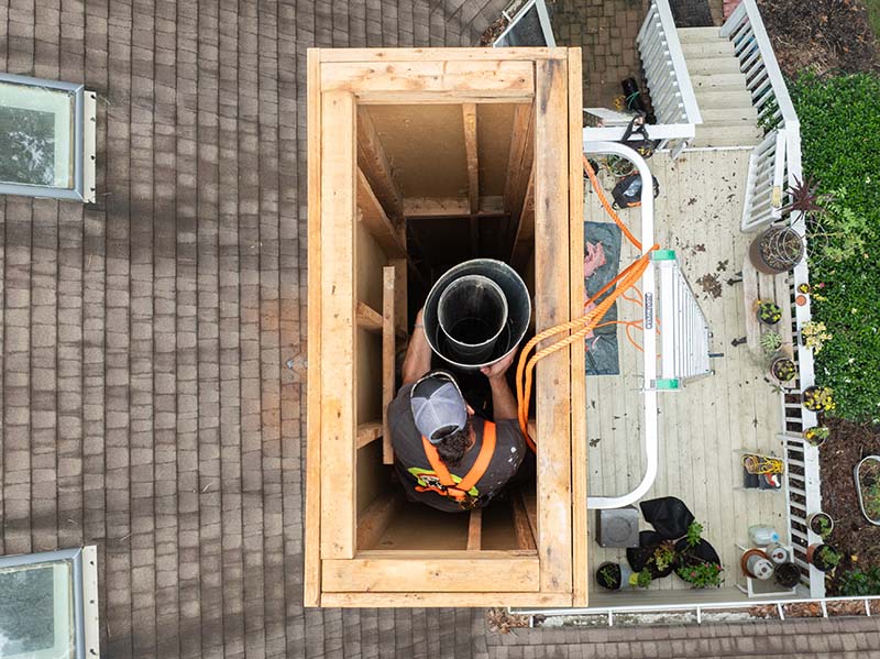 Mr Smokestack - Original image of relining top view of chimney without cover